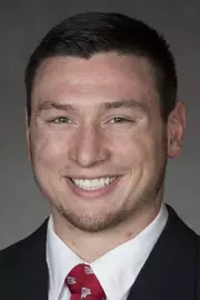 Mason Reinhardt headshot in suit