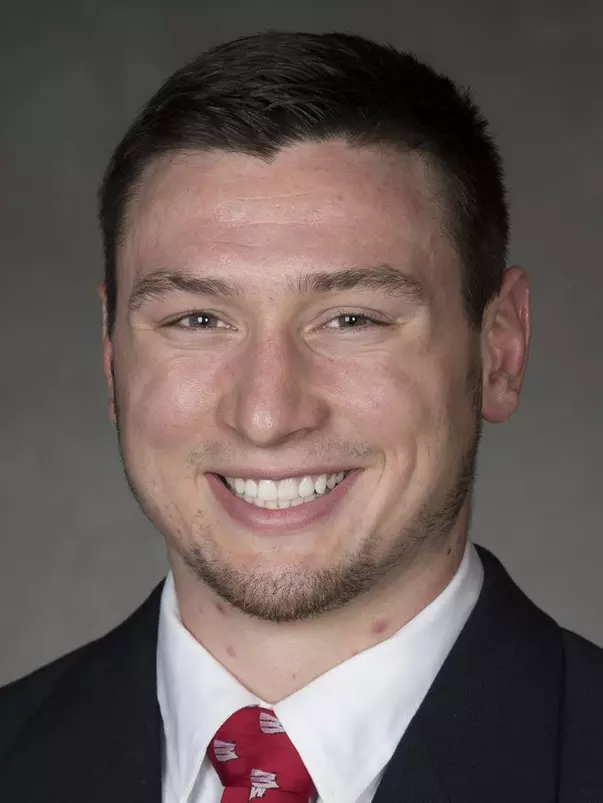 Mason Reinhardt headshot in suit