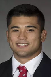 Quintanilla headshot in suit