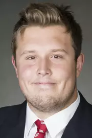 Ian Dretzka headshot in suit