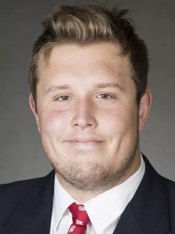 Ian Dretzka headshot in suit