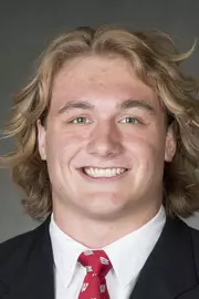 Trent Hillger headshot in suit