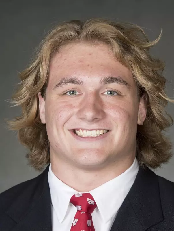 Trent Hillger headshot in suit