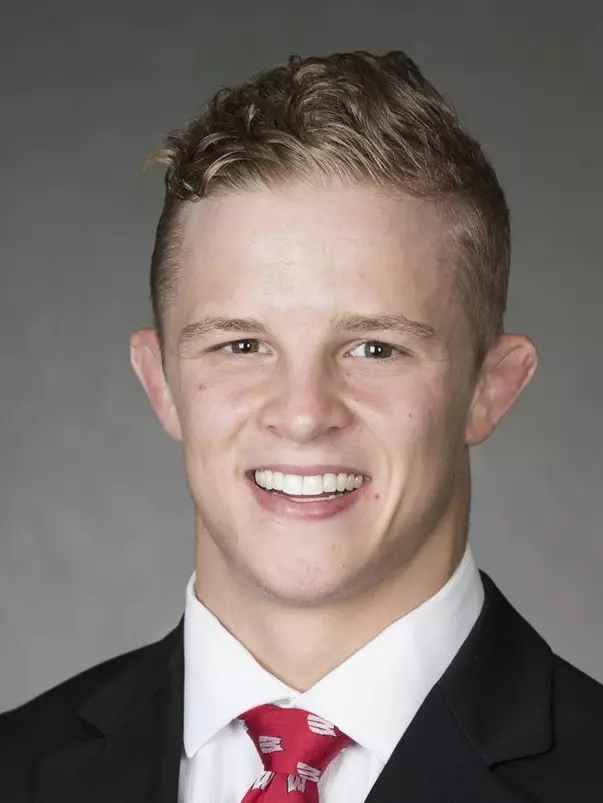 Eli Stickley headshot in suit