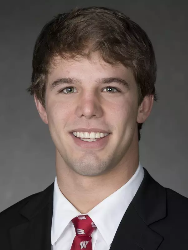 Gabe Grahek headshot in suit