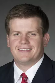 Eric Peissig headshot in suit