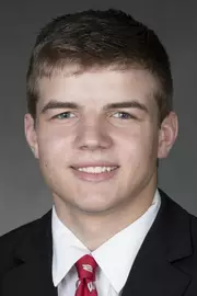 Tyler Shilson headshot in suit