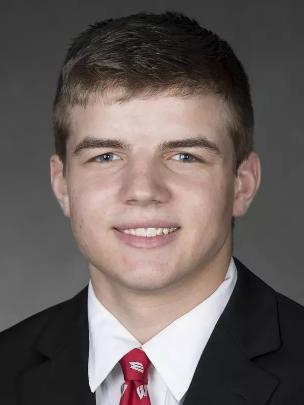 Tyler Shilson headshot in suit