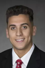 Johnny Jimenez headshot in suit