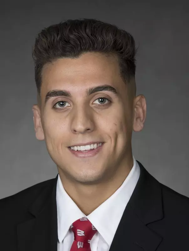 Johnny Jimenez headshot in suit