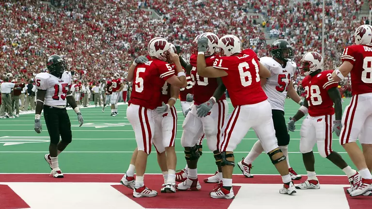 University of Wisconsin quarterback Brooks Bollinger (5) celebrates a touch down with his teammates during the Northern Illinois football game at Camp Randall in Madison, Wisconsin, on 9/14/02. The Badgers beat Northern Illinois 24-21