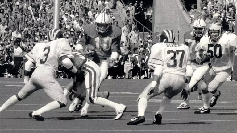 Quarterback Jess Cole carries the ball vs. Michigan inside Camp Randall Stadium 1981