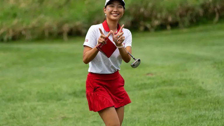 Vanessa Ho, Wisconsin women's golf, holds her hands up in a "W" at the 2022 Badger Invitational at University Ridge Golf Course in September 2022 in Madison, Wisconsin.