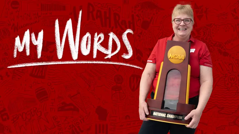 Diane Nordstrom, Associate Director of Brand Communications for Wisconsin Athletics, holds the 2021 NCAA Women's Volleyball Championship trophy. The photo has the logo of "My Words" overlaid over the image.