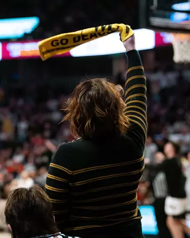 Photo of fans waving rally towels at LJVM Coliseum