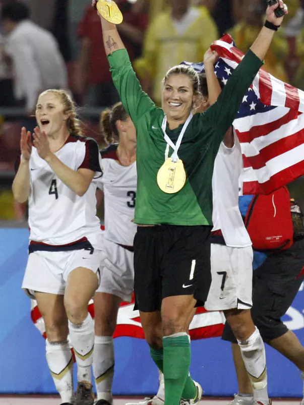 The United States' Rachel Buehler (4) and goalkeeper Hope Solo (1) celebrate aft