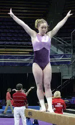 Ashley Houghting Ties For First Place on Beam as Huskies Fall at No. 5 UCLA