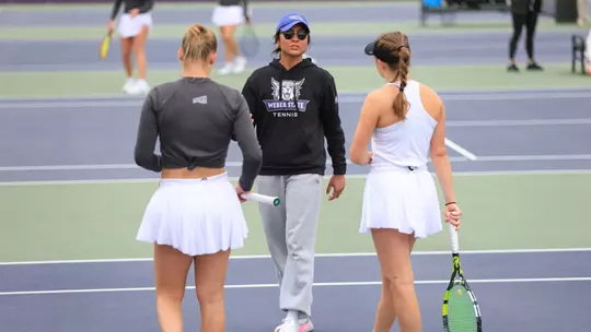 Graduate Assistant Coach Ana Morett coaches two players against Sacramento State in 2025