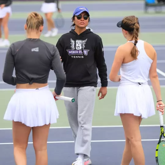 Graduate Assistant Coach Ana Morett coaches two players against Sacramento State in 2025