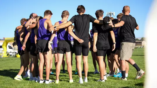 Men's cross country huddle