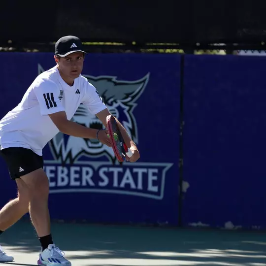 Clement Lecoq serves in a match against NAU in 2026
