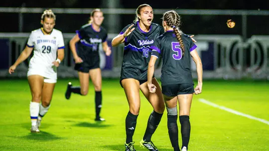 Wildcat soccer players celebrating