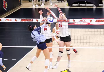 Setter Callie Bauer (14), Middle hitter Izzy Van De Wiele | Photo by Savannah Philpot