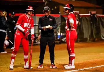 WKU Hilltoppers infielder Anna Mauck (23), WKU Hilltoppers utility Annie White (16) | Photo by Savannah Philpot