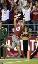 Cougars Play Tough, but No. 2 Ducks Pull Away, 51-26