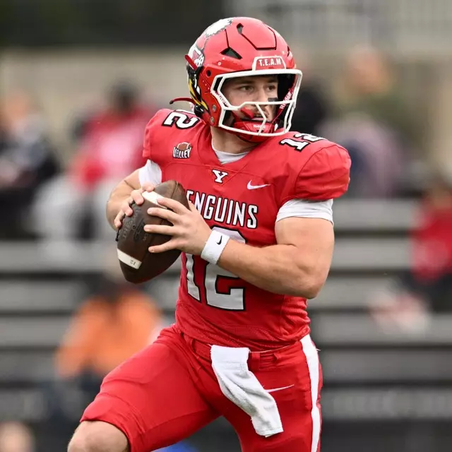 YSU quarterback Beau Brungard rolls to his right holding the football in the Penguins' home game against Indiana State on Nov. 15, 2025.