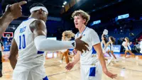Cal Conroy and Tylen Riley celebrate Tulsa's win over Manhattan Christian