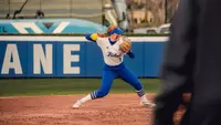 Maci Cole throws over to first base against UTSA