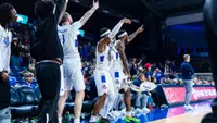 The Tulsa bench celebrates against UTSA