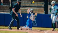 Amber Turner throws the ball back to the pitcher against South Florida