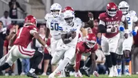 Dexter Williams II scrambles against Arkansas