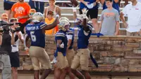 Zach Williams celebrates an interception against Oklahoma State