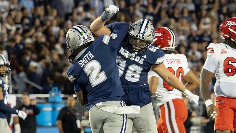 EJ Smith and Tanner Vaughan celebrate a defensive play