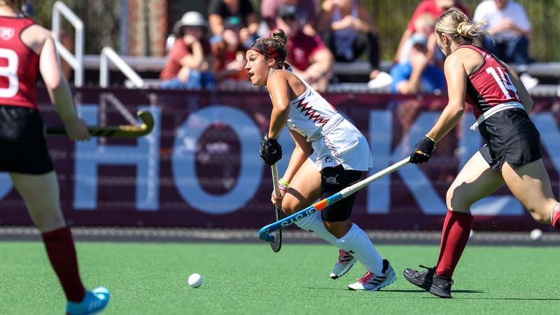 Maria Armaganian playing field hockey for Northeastern University.
