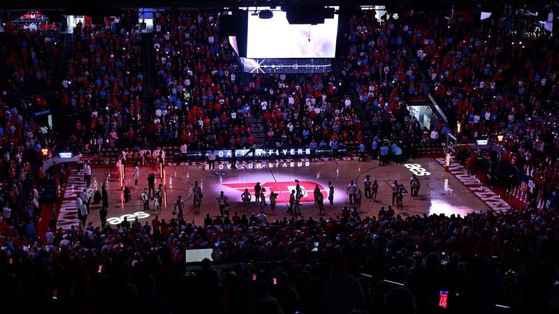 A photo from above the Epicenter of College Basketball, UD Arena, with the lights down during introductions.