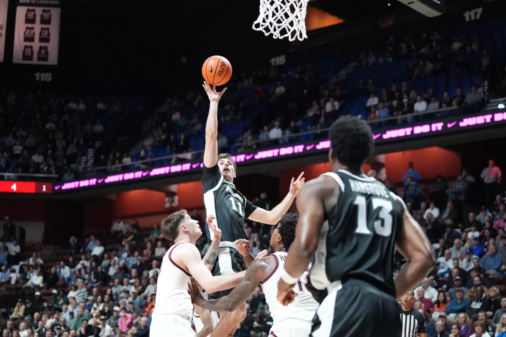 Ryan Mela attempts a floater against Virginia Tech at Mohegan Sun on Nov. 8. 