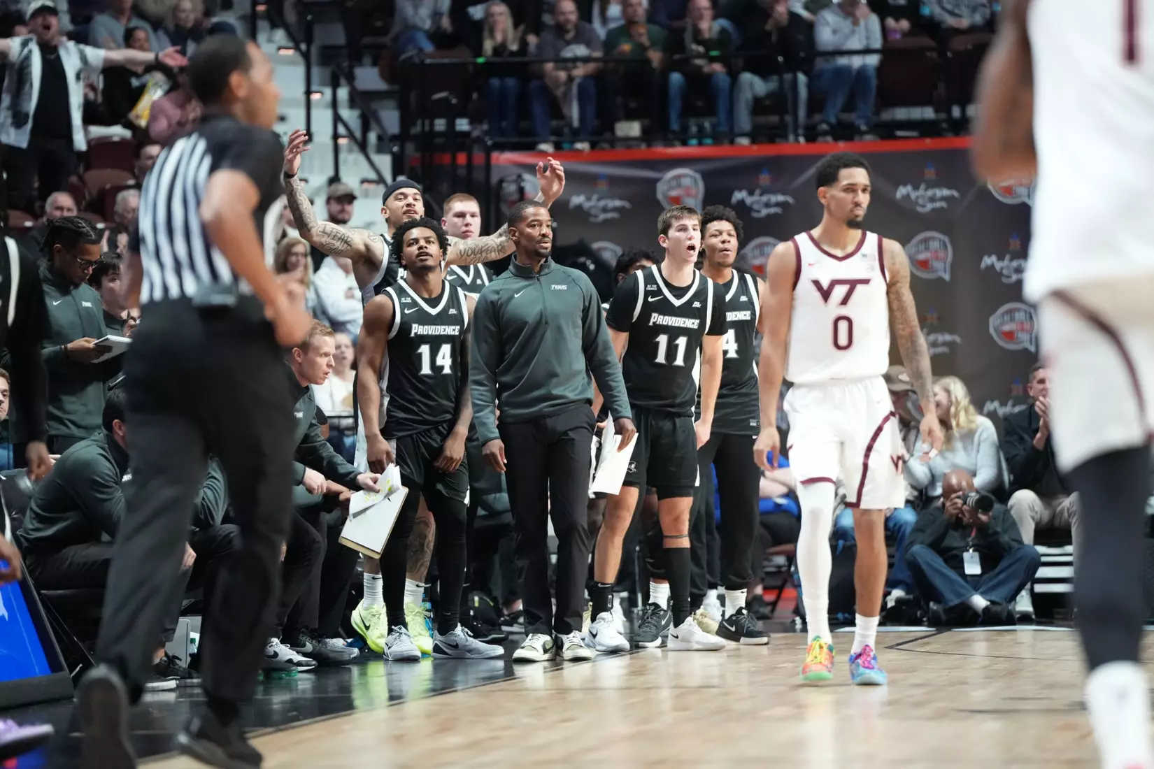 The bench stands behind Kim English against Virginia Tech at Mohegan Sun on Nov. 8. 