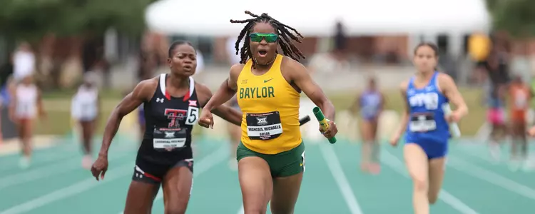 Michaela Francois winning Big 12 4x1 title