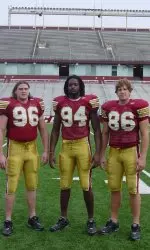 2004 team tri-captains Tim Bulman, Mathias Kiwanuka and David Kashetta model the 1984 "throwback" uniforms.