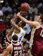 UCLA's Arron Afflalo has his shot blocked by Craig Smith and Nate Doornekamp as Sean Marchall looks on during the first half.