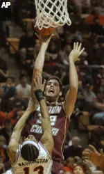 John Oates shoots over  Deron Washington during the first half. (AP Photo/Don Petersen)