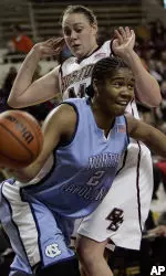 Kathrin Ress plays defense against North Carolina's Erlana Larkins during the first half. (AP Photo/Chitose Suzuki)