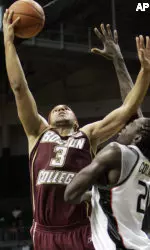 Jared Dudley is fouled by Miami's Dwayne Collins in the second half. (AP Photo/Alan Diaz)
