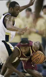 Tyrese Rice, right, tries to get under and around the pressure by Georgia Tech guard Mario West.
