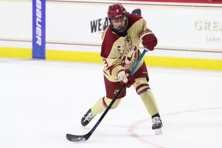 Hadley Hartmetz takes a slap shot against UConn.