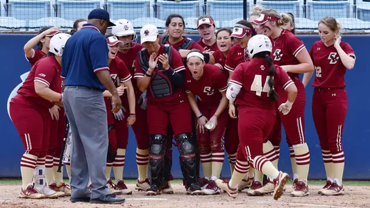 Emme Martinez is greeted at the plate by her teammates after her 2nd home run of the season.